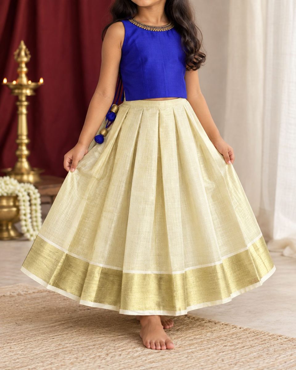 Girl in royal blue top and kasavu pavada
